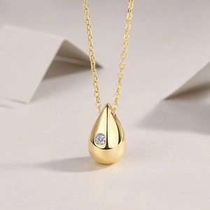 Elegant 925 sterling silver gold teardrop pendant necklace with sparkling moissanite stone