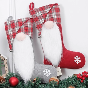 Christmas gnome stockings with bells and snowflake embroidery in red and grey colors