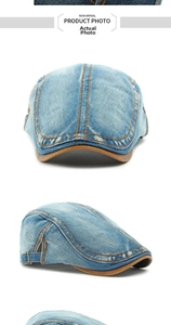 Detail of washed denim beret with brown leather trim and orange stitching accents
