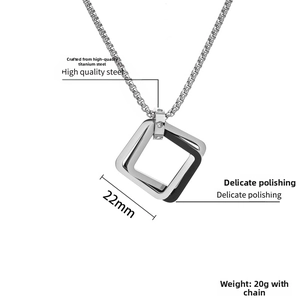 Close-up of geometric square titanium steel pendant with dimensions and weight specs