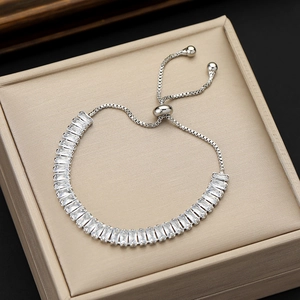 Silver adjustable bracelet with baguette cut cubic zirconia stones in a pull-string design