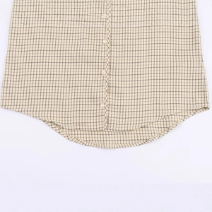 Fashion casual plaid shirt with a curved hem and four yellow buttons in cream white