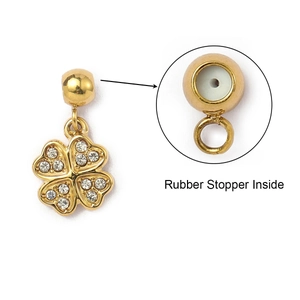 Detail of gold clover pendant with crystals and internal rubber stopper for jewelry