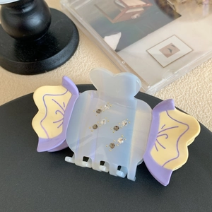 Graziosa pinza per capelli in acetato blu e giallo con strass colorati scintillanti