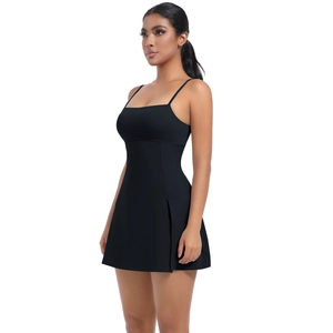 Close-up of a black athletic tennis dress featuring a slim fit cut and side slit detail