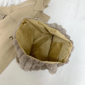 Furry striped tote bag for women featuring a spacious interior with magnetic snap closure
