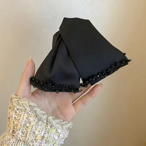 Elegant black satin fabric bow hair claw clip with crystal bead trim for women