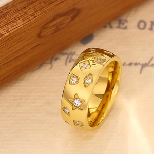 Gold stainless steel ring with star and geometric cutouts featuring sparkling zircons