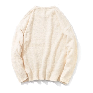 Back view of cream white knitted sweater showing soft textured knit fabric