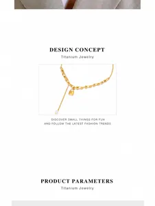 Detail of gold titanium U-shaped chain necklace with lock charm and pearl tassel
