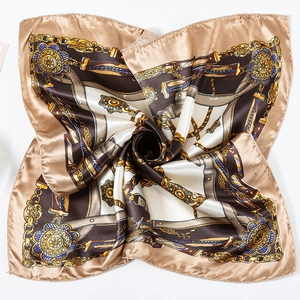 Macro shot of 50cm square silk scarf with golden baroque chain print and elegant folds