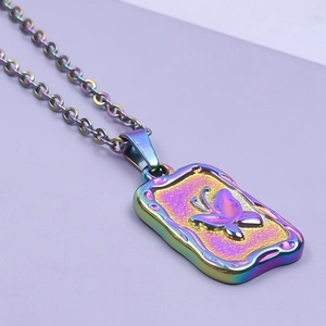 Macro shot of rainbow-plated stainless steel necklace with embossed butterfly pendant
