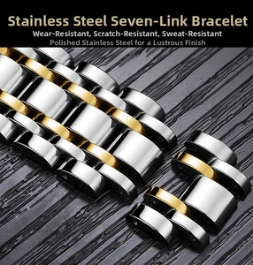 Macro shot of two-tone gold and silver stainless steel seven-bead watch bracelet