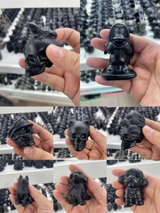 Detailed collage of matte black obsidian figurines including skull and puppy designs