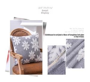 Détail de la housse de coussin de Noël en peluche grise avec flocon et fermeture éclair