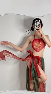 Detail of red Hanfu lingerie with gold floral embroidery and green tulle skirt