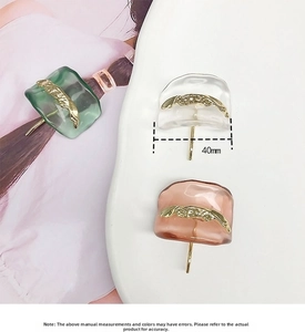 Detail view of 40mm resin accessories with wavy texture and gold metallic inlay