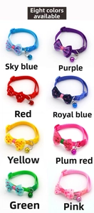 Detail showing eight colors of adjustable pet collars with bows and bells for small dogs