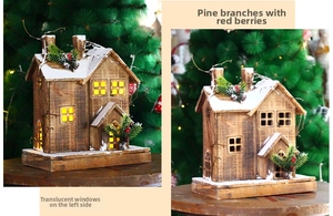 Detail of wooden Christmas cabin with warm LED lights and artificial snow and pine needles