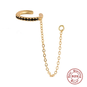 Detail of 925 sterling silver gold ear cuff chain featuring black gemstones and circle drop