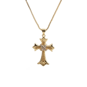 Golden cross pendant necklace with white zircon accents on a minimalist white background