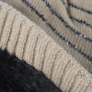 Women's warm striped knit beanie with thick fleece lining for winter outdoor comfort