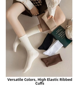Detail of ribbed cotton mid-calf socks in diverse neutral colors for casual daily wear