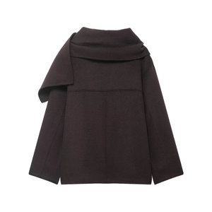 Detail view of the back of a dark brown wool blend coat with asymmetric lapel and seam
