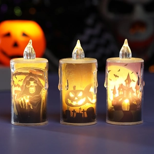 Halloween LED candle set with skull and ghost silhouettes emitting warm flickering light