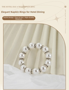 Detail of luxury napkin ring featuring elegant white pearls and sparkling rhinestone accents
