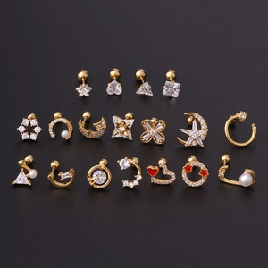 Golden stainless steel cartilage studs set with zircon and pearls on black background