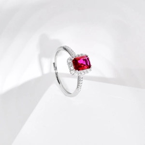 Detail view of S925 hallmark on silver ring with rectangle red zircon and halo stones