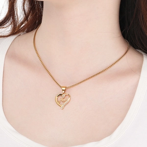 Gold heart Mom necklace with sparkling diamonds on a model for Mother's Day gift