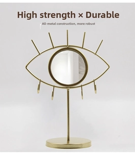 Golden eye-shaped jewelry stand with makeup mirror and 4 hooks in modern metal style