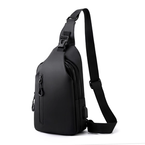 Men's sleek black water-resistant crossbody chest bag with integrated USB charging port