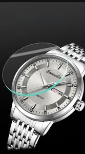 Detail of silver business watch dial with sunburst texture and dual calendar display