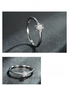 Close-up of S925 sterling silver ring featuring baguette-cut zircon on a dark texture