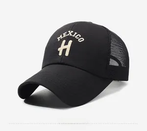 Detail view of black trucker hat with Mexico embroidery and breathable mesh texture