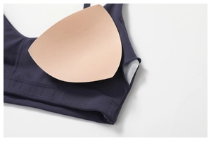 Detail of breathable mesh lining and removable triangular foam padding for sports bra