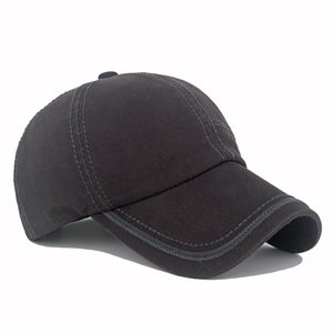 Detailed side view showing stitching and washed cotton texture of the dark gray baseball cap