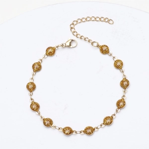 Detail of 18K gold plated bracelet with glitter-filled round beads and lobster clasp