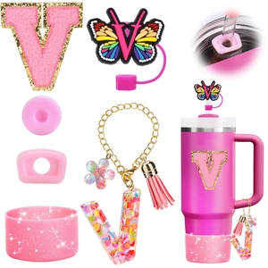 Pink Stanley cup accessories set featuring letter V resin charm and glitter straw cover