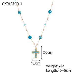 Detail view of a gold cross pendant necklace with blue stones, weight 6.6g and length 45cm
