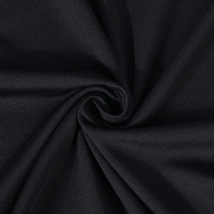 Macro shot of high-elastic black knit fabric showing soft texture and smooth draping