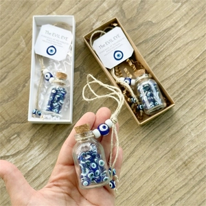 Blue Evil Eye wishing bottle charm with cork stopper and hemp rope in gift packaging