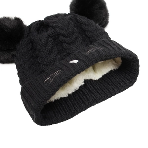 Detail showing plush thick faux fur lining and cable knit texture of a warm baby cat hat