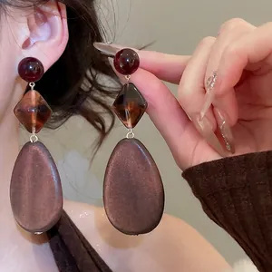 Retro geometric drop earrings with wood texture pendants and deep red resin spheres