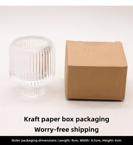 Detailed view of striped glass candle holder with brown kraft packaging box and dimensions