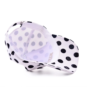 Adjustable white baseball cap with black polka dots and stylish gold embroidered letters