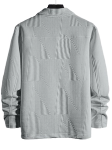 Detail view of the 3D geometric jacquard texture on back of light grey casual jacket